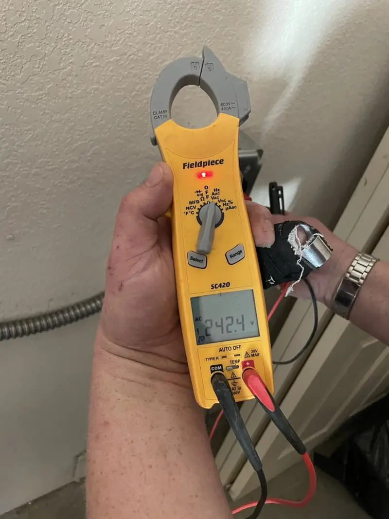 Voltage testing with clamp meter during Whole House Surge Protector in Sand Springs